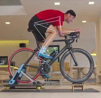 The same rider at the top of the pedal stroke, with the knee and hip at their most bent.