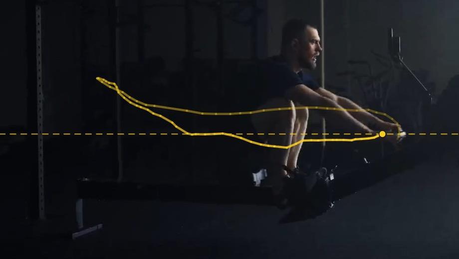 The same rower back at the catch, with the path the erg handle took through the previous stroke traced in yellow.